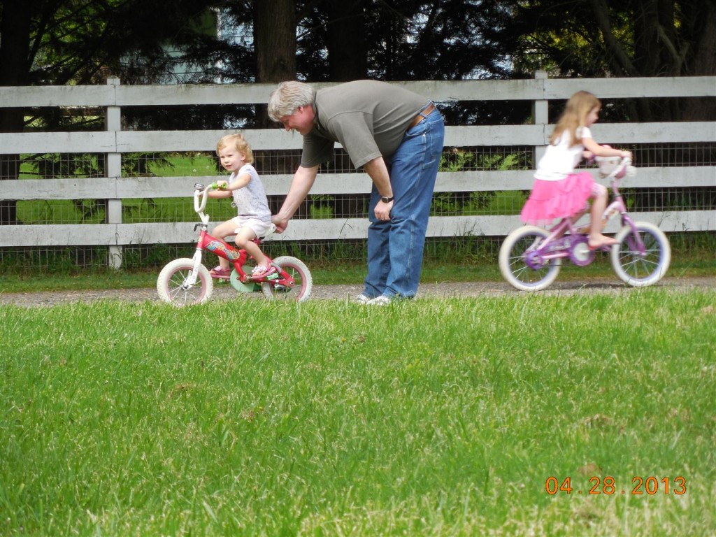 The grandpas took turns helping Maggie ride her bike... Anna went up and down, showing us how fast she is!