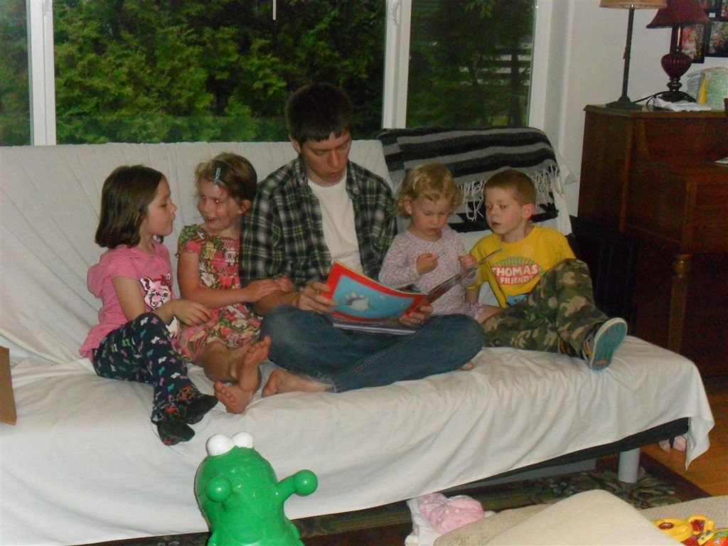 Brian reading to four of the eight kids where were here.