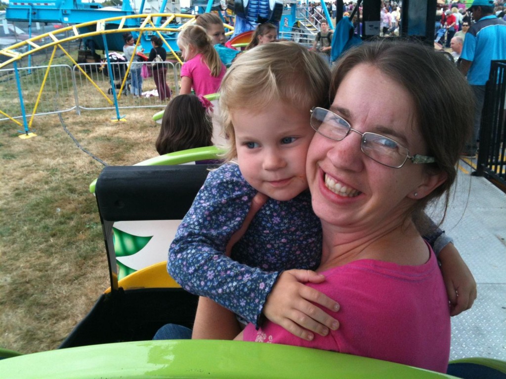 Maggie was game for the little kid roller coaster, even though she was scared.  Brave, brave girl!