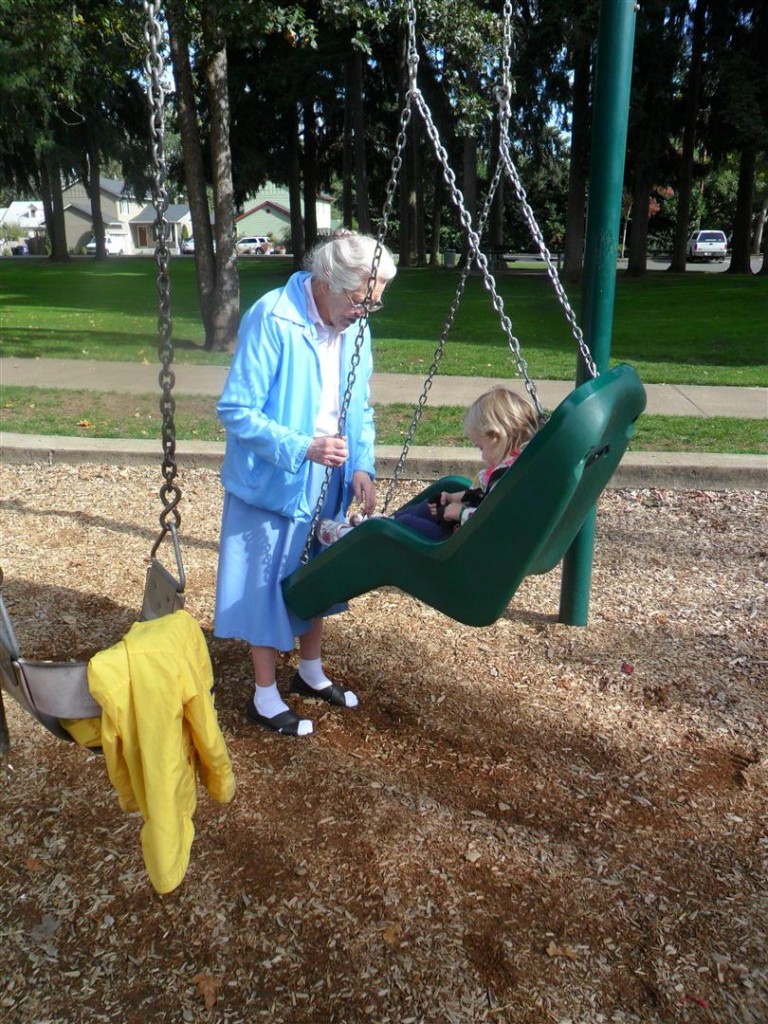 Great-Grandma Reta pushing Maggie in the adaptive swing.