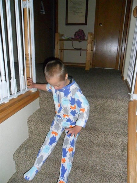 Jordan woke up just as the girls finished their stockings! He loves to slide down the stairs this way.