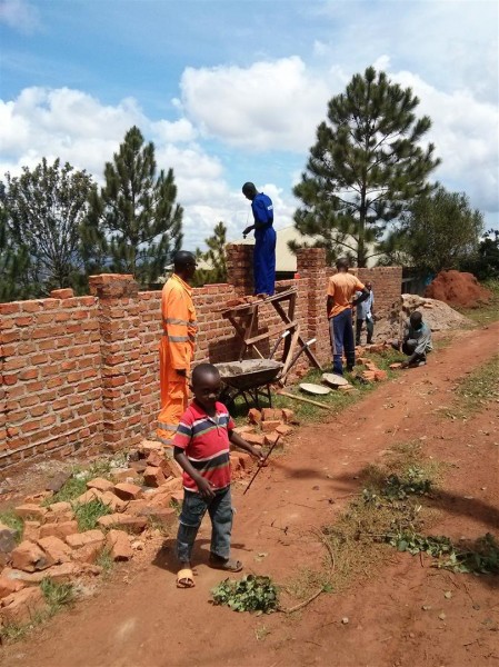 The wall around the clinic compound getting built...