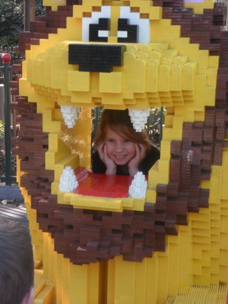 All the kids were going to pose in the Lego lion until a sensor "saw" them and it roared. Then Anna plugged her ears and went in for a very short smile. haha
