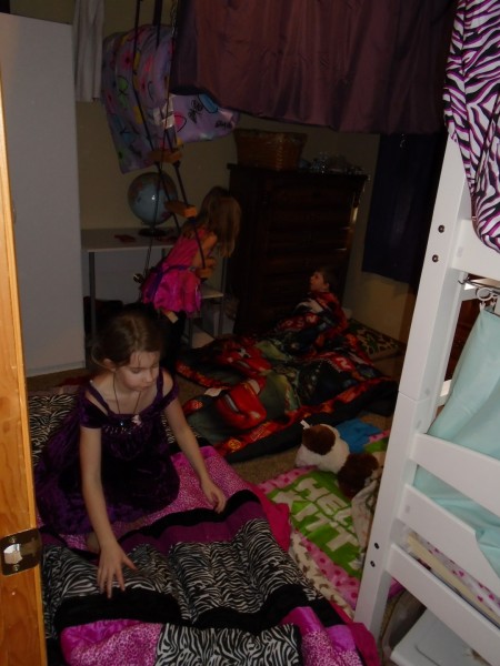 The cousins spent the night and started the night with everybody sleeping on the same floor in the girls' room. 