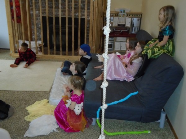 Cousins getting to watch a movie in their dressup!