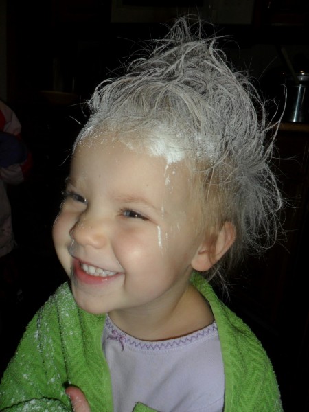 Trying to get the vaseline out with corn starch. Ugh - what a waste of time and supplies. But the cradle cap is better!