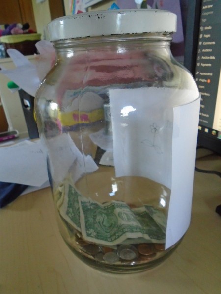 This is our orphan care savings jar! There is about $15 in there already!
