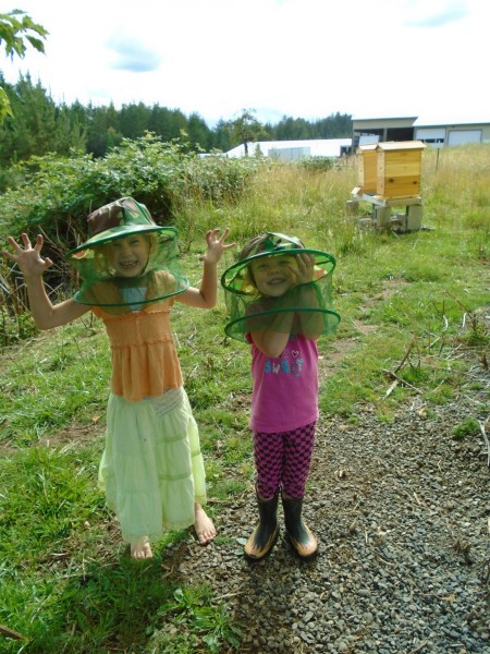 Margaret and Carolyn put on veils to come check out how the bees are doing with me.