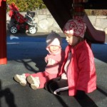 True story. Anna is saying, "This park is really nice, because you can sit here under the play structure, which is good, because now I'm not getting hot in the sun." Somebody needs to explain the winter solstice to her, I guess. ;-)