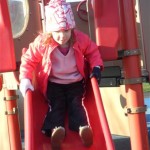 Yippee! The confident girl who used to be scared of this slide.