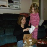 I love the look on Anna's face here as I open the "present" she gave me. It was pieces of paper with scribbled "words" all over them. She read and sang them to me later so I'd know what they said.