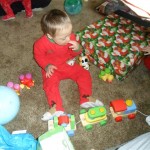 Jordan being completely unimpressed wtih his presents. He rocked more and sucked his fingers and did his best to turn his back to the commotion... good survival skills their buddy! Can't wait to see you next year!