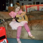 Anna's awesome new guitar. (Thanks Target!) Each kid got three gifts from us - Anna got the swing, the guitar and dressup. Her gifts from granparents were particularly good this year too. We have lots of fun to have over the rest of the winter!!!