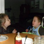 Anna being an amazing big sister. She's talking to Jordan here and trying to get him to eat a crumb of muffin)