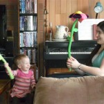 Playing "swords" and laughing hysterically.... with huge, bendy flowers.
