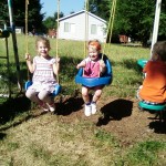 Playing on the neighbors swing.