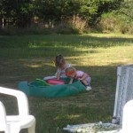 Playing in the 1/2" of sand that has made it to the sandbox so far. (I think they were 'building' an ant hill.)