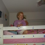 My silly girls playing together in the top bunk.