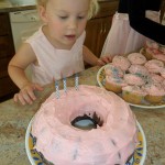 Maggie looking at her cake, which I decided to bake in a bundt pan. "It looks like a doughnut!"