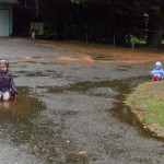 I decided to take pictures first. Then I told them that YES, they could continue to sit in the puddles. 
But never again. ;-)