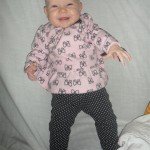 She is SO CUTE! (And no, she cannot stand or sit on her own yet. Well, for brief periods, she can)