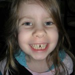 Last picture with all her baby teeth. (And that gap between her front teeth - she says she lost a tooth there one day. But I'm afraid that's just how they grew.)