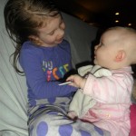 Anna having some baby sister time.  Carolyn adores her big sisters! 